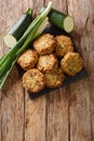 TraditionalÃÂ GreekÃÂ kolokithokeftedes zucchini and feta balls close-up on a slate board. Vertical top view Royalty Free Stock Photo